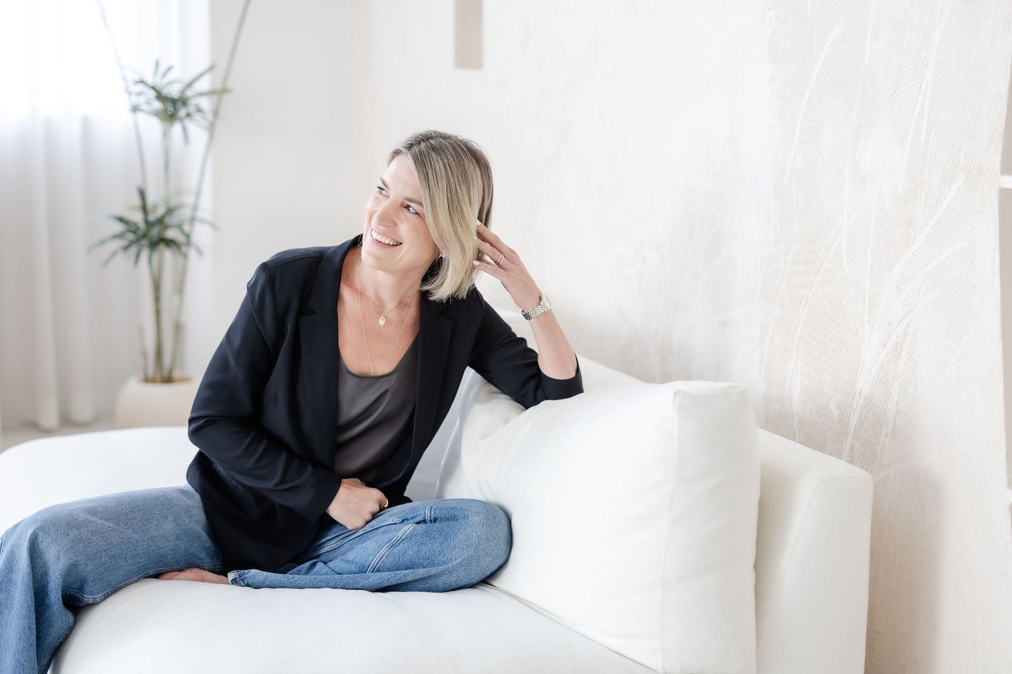 Psychotherapist in Singapore Yvonne smiling, soft lighting, laughing.