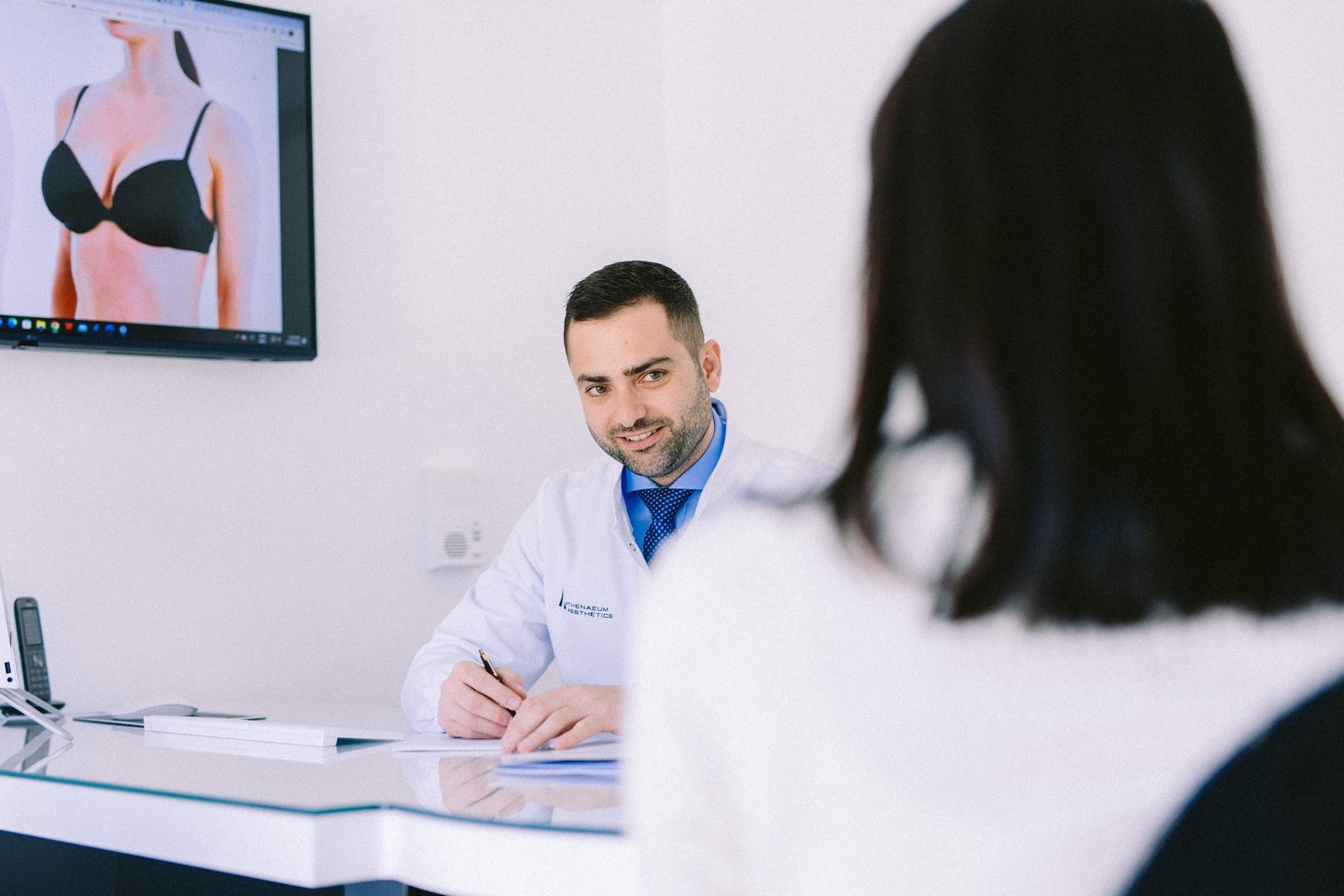 Dr Antonios Diamantopoulos during patient consultation at Athenaeum Aesthetics