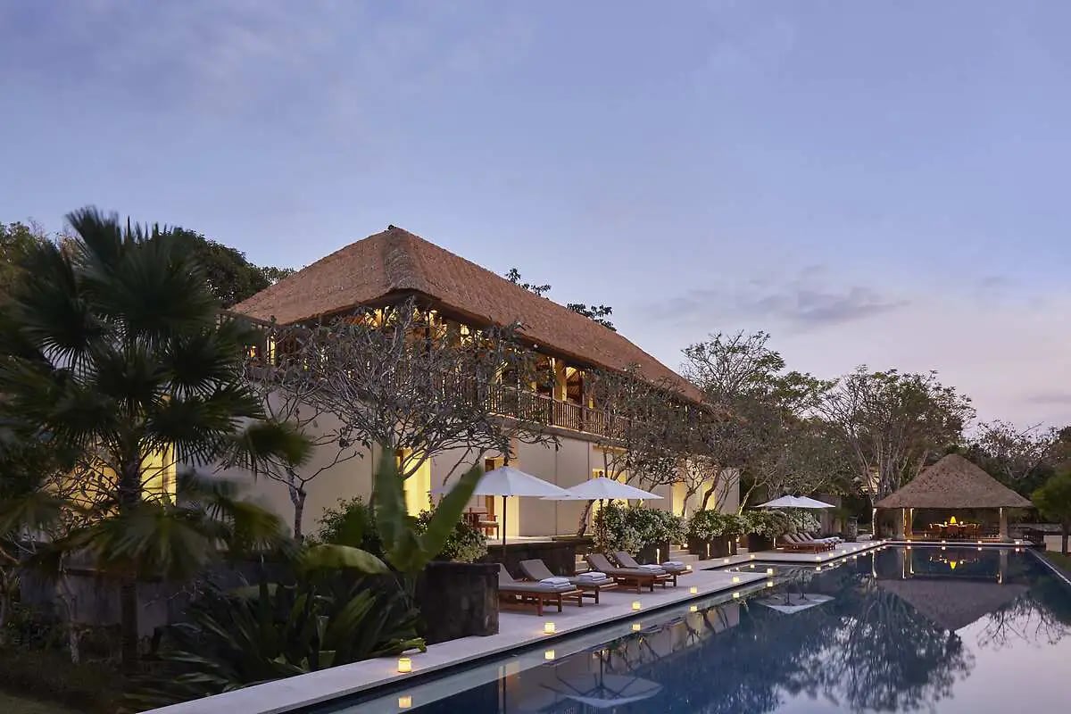 Luxury Aman Villa at Nusa Dua, Bali, featuring a private infinity pool, tropical garden, and modern Balinese architecture 