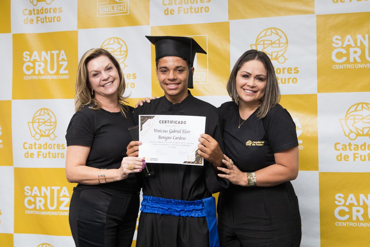a man and woman in black and white graduation gowns