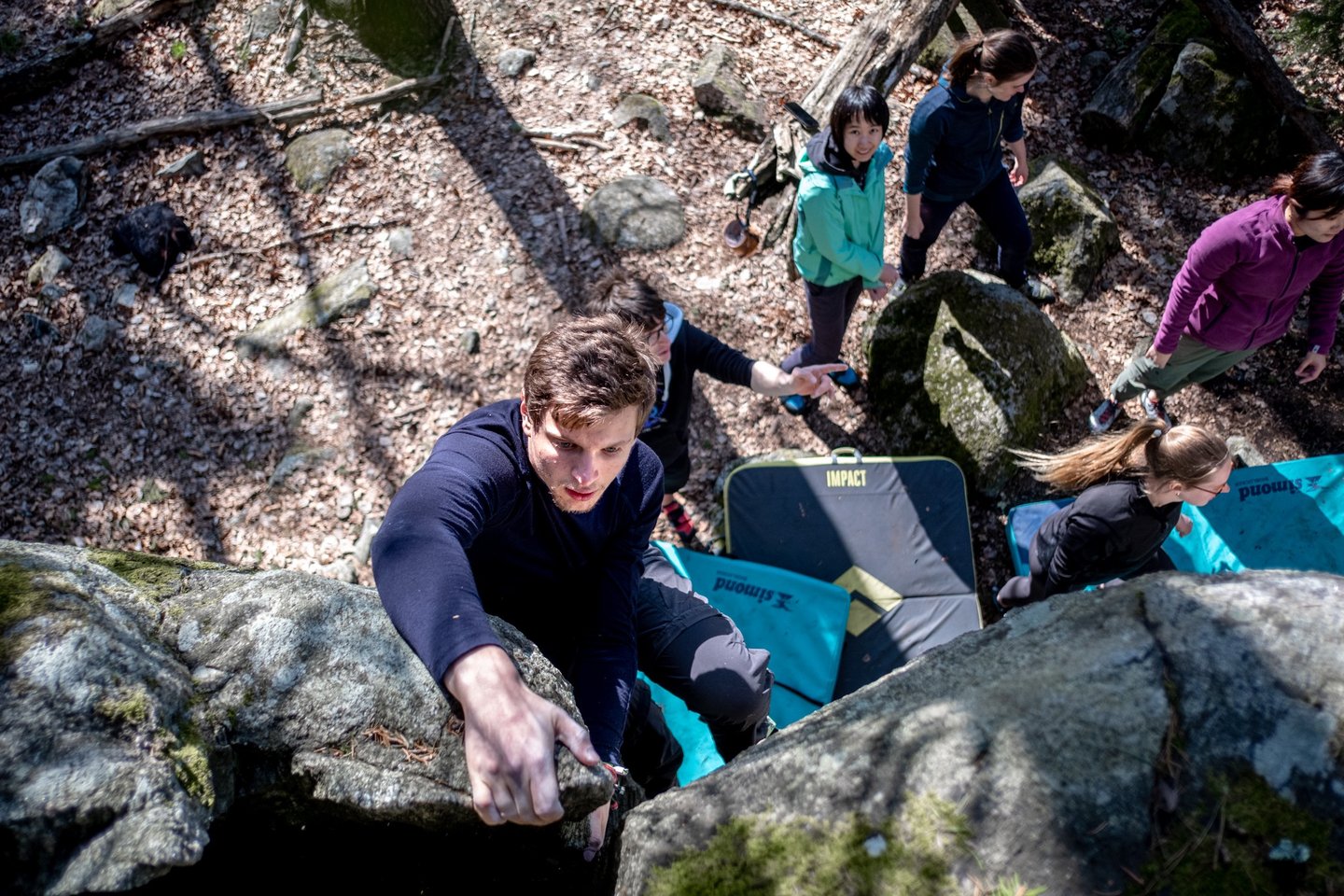 a man climbing a rock face down a steeple