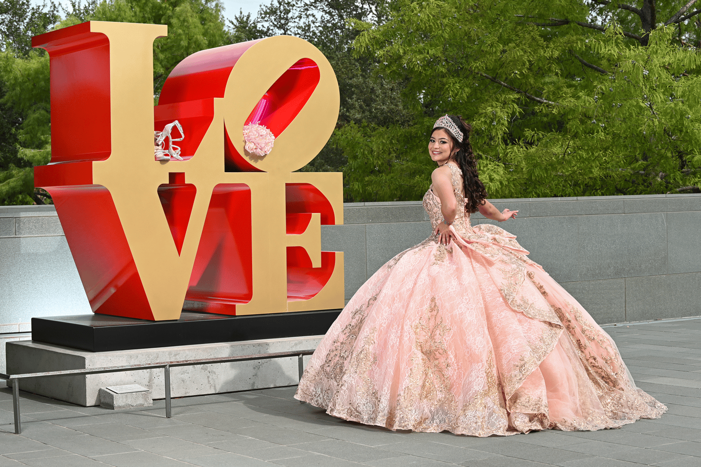 quinceanera girl in front of Love sign