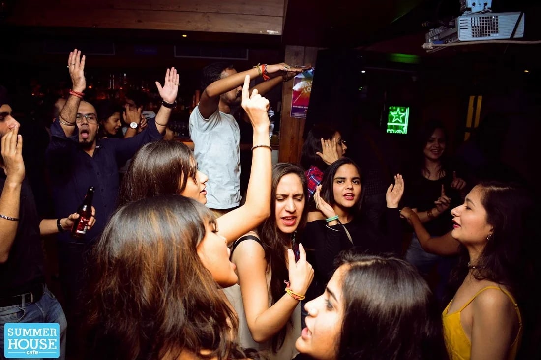 a group of people standing around a party