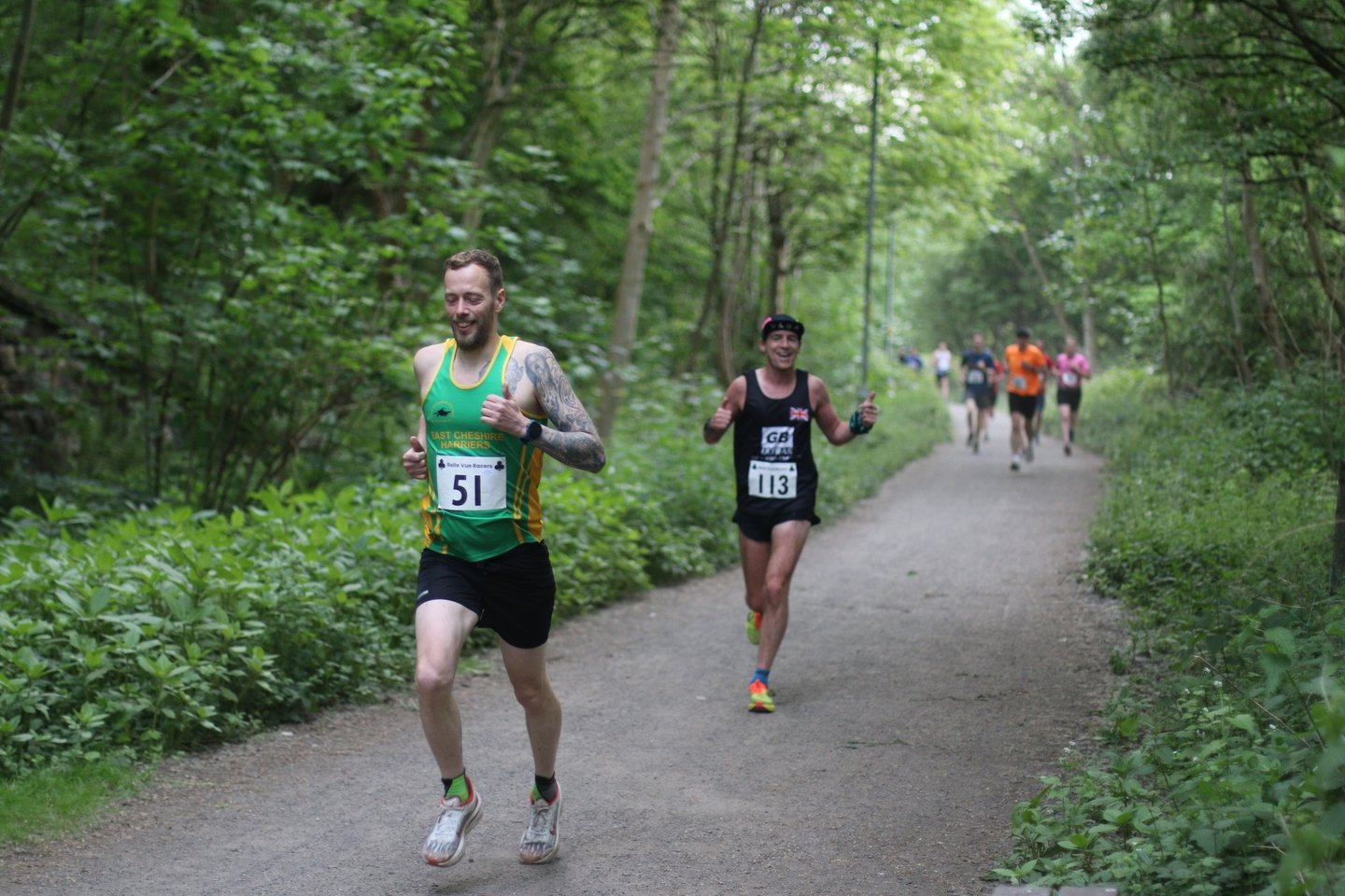 a man running on a path in a wooded area