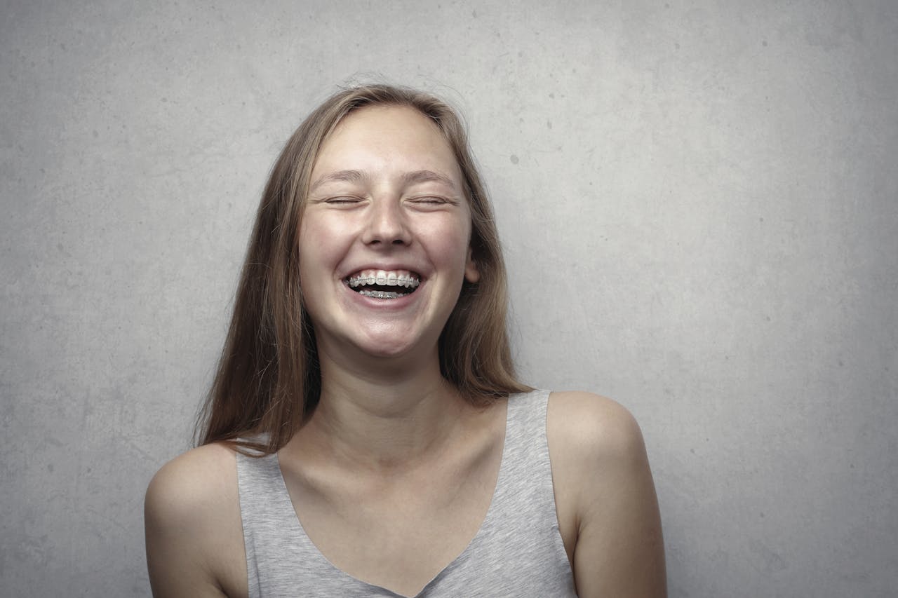 Photo by Andrea Piacquadio: https://www.pexels.com/photo/woman-in-gray-tank-top-laughing-3812740/