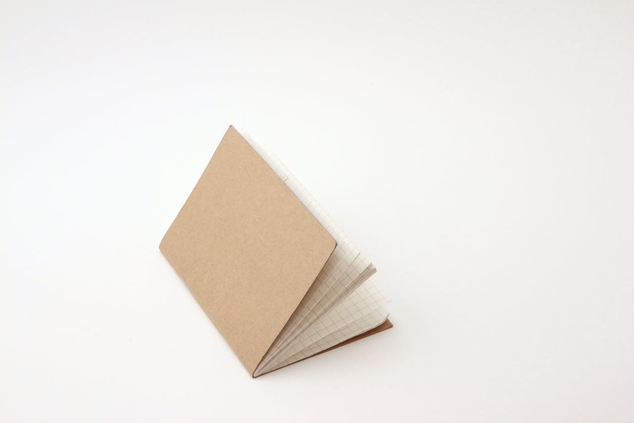 Photo by wutthichai charoenburi: https://www.pexels.com/photo/notebook-on-white-background-19810873/