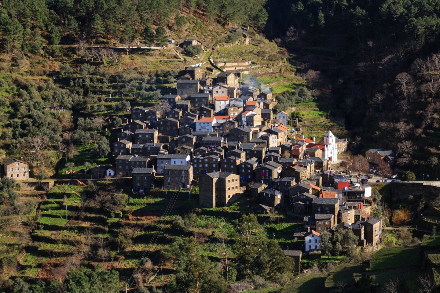 Stone schist village of Piodao nestled in the green Serra da Estrela mountains of Portugal.