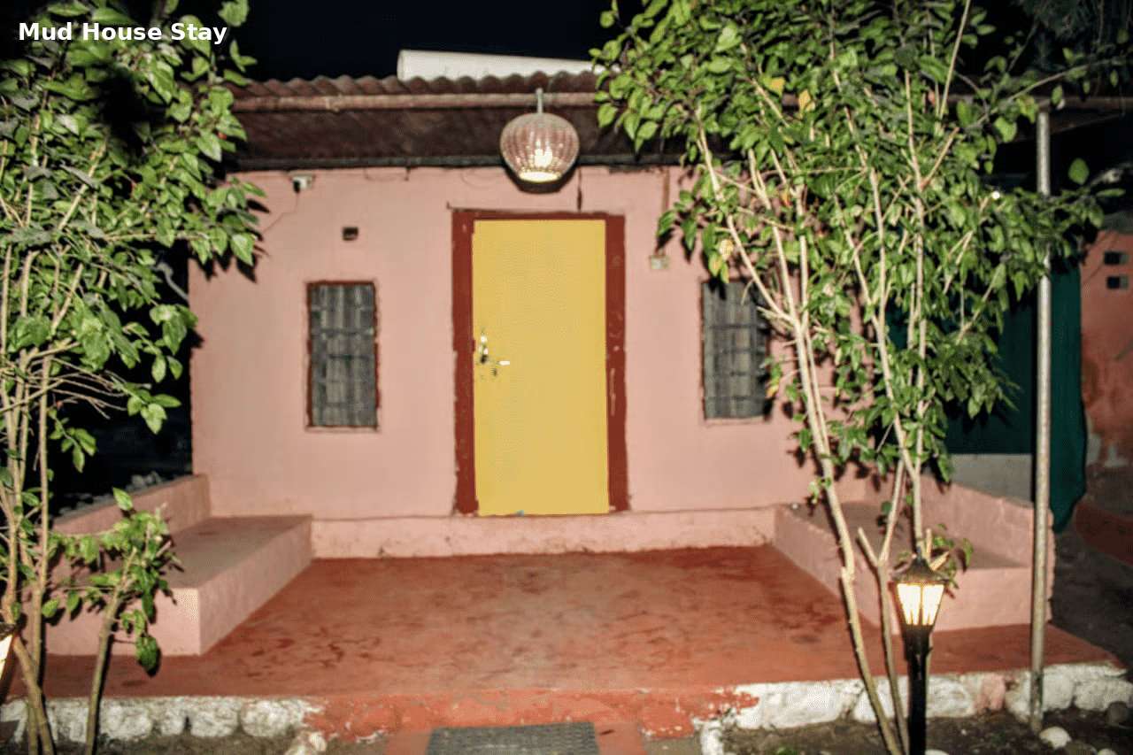 Traditional mud house stay at Jungle Lore Resort with rustic interior