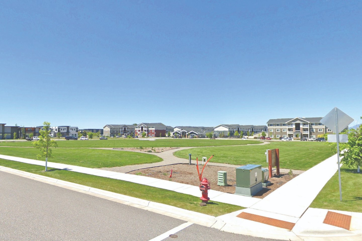 a park with a playground structure and a playground structure