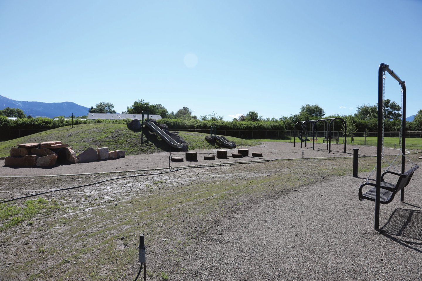 a playground with swings, swings, and swings