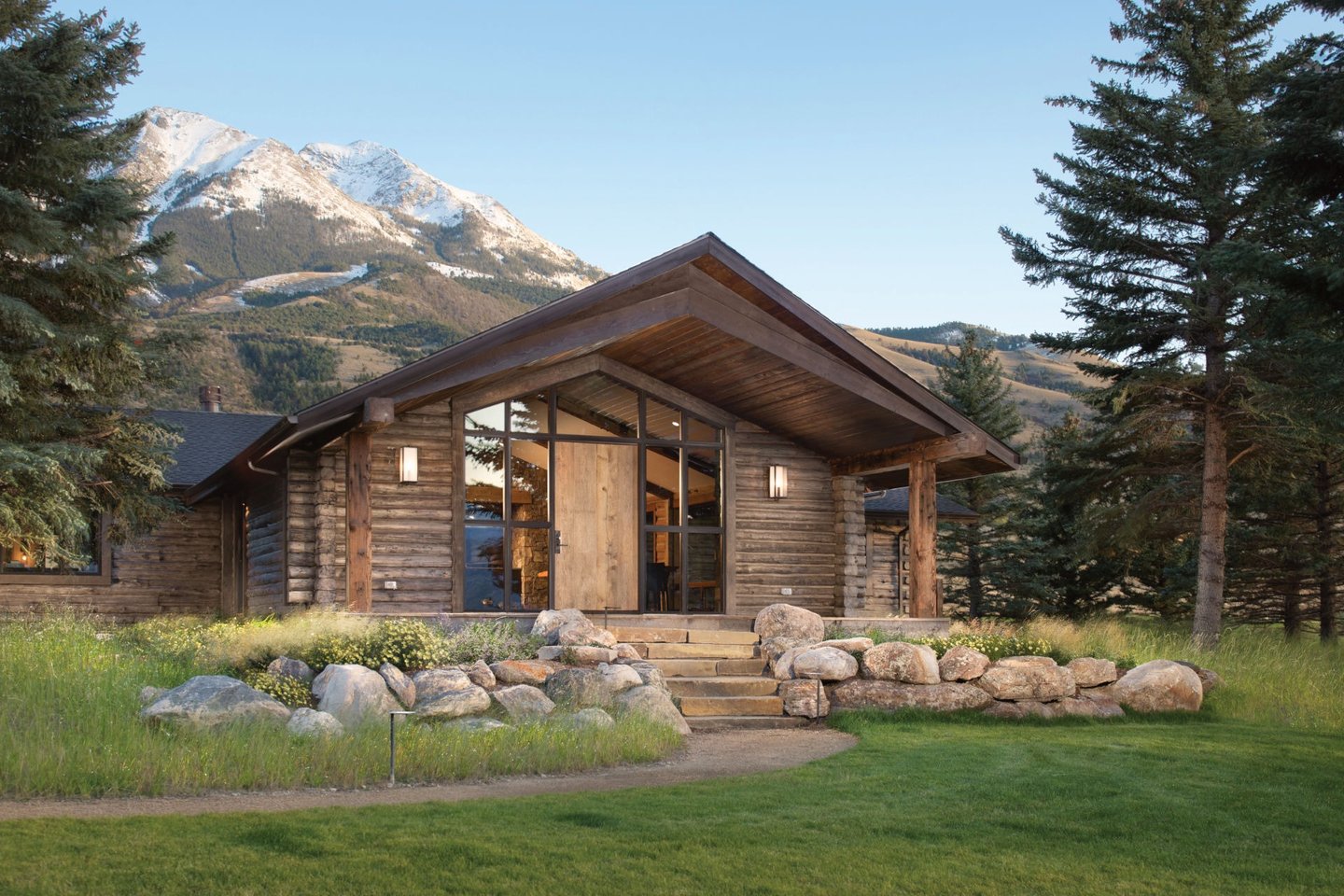 a log cabin with a mountain view of a mountain