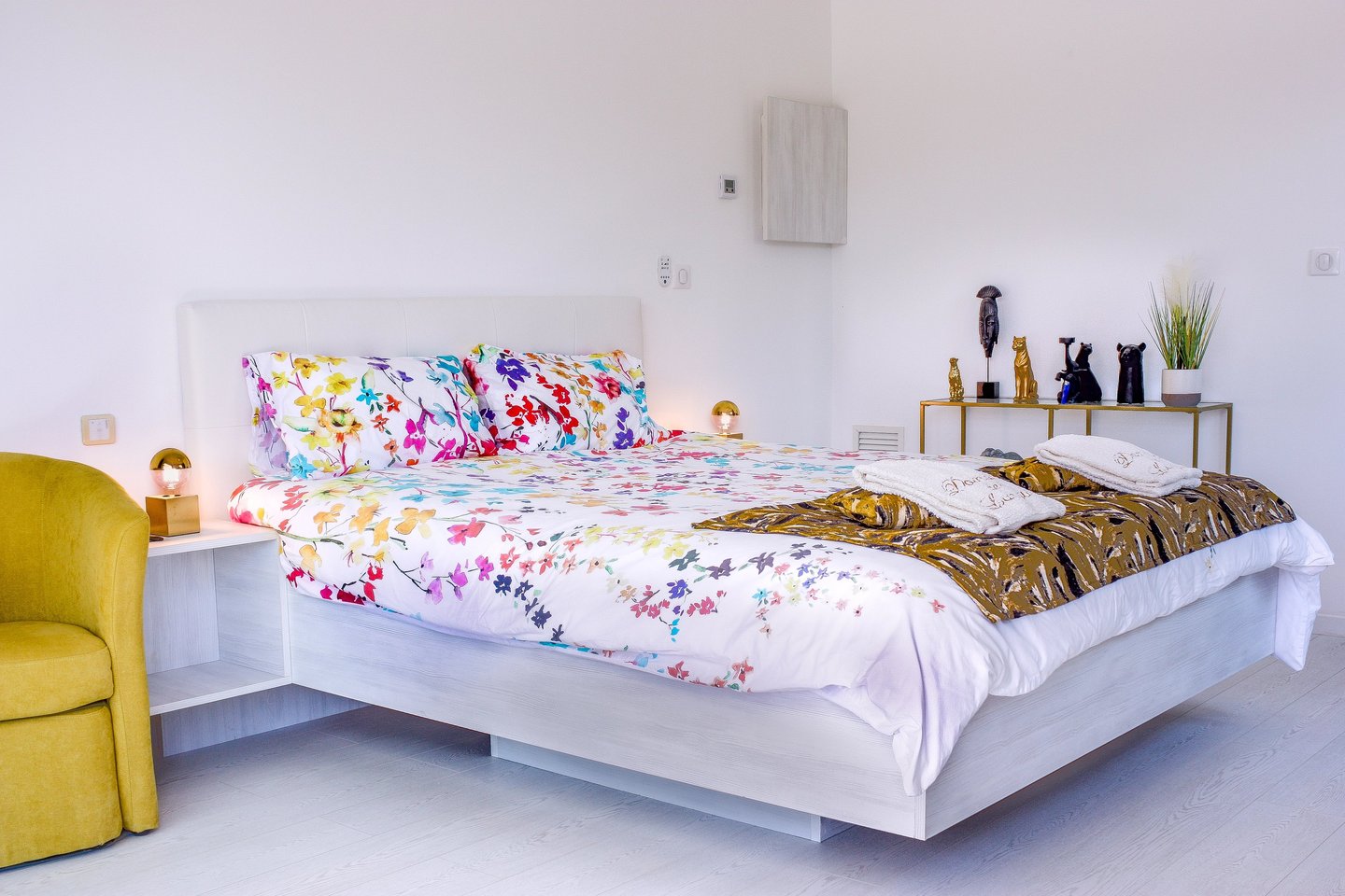 Bedroom with king size bed, air conditioner, built-in bathroom and television at Domaine Des Lucques