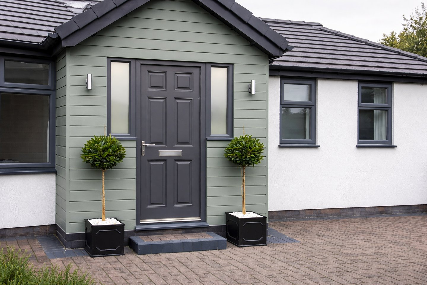 Modern front porch extension with new entrance door on Brighton home.
