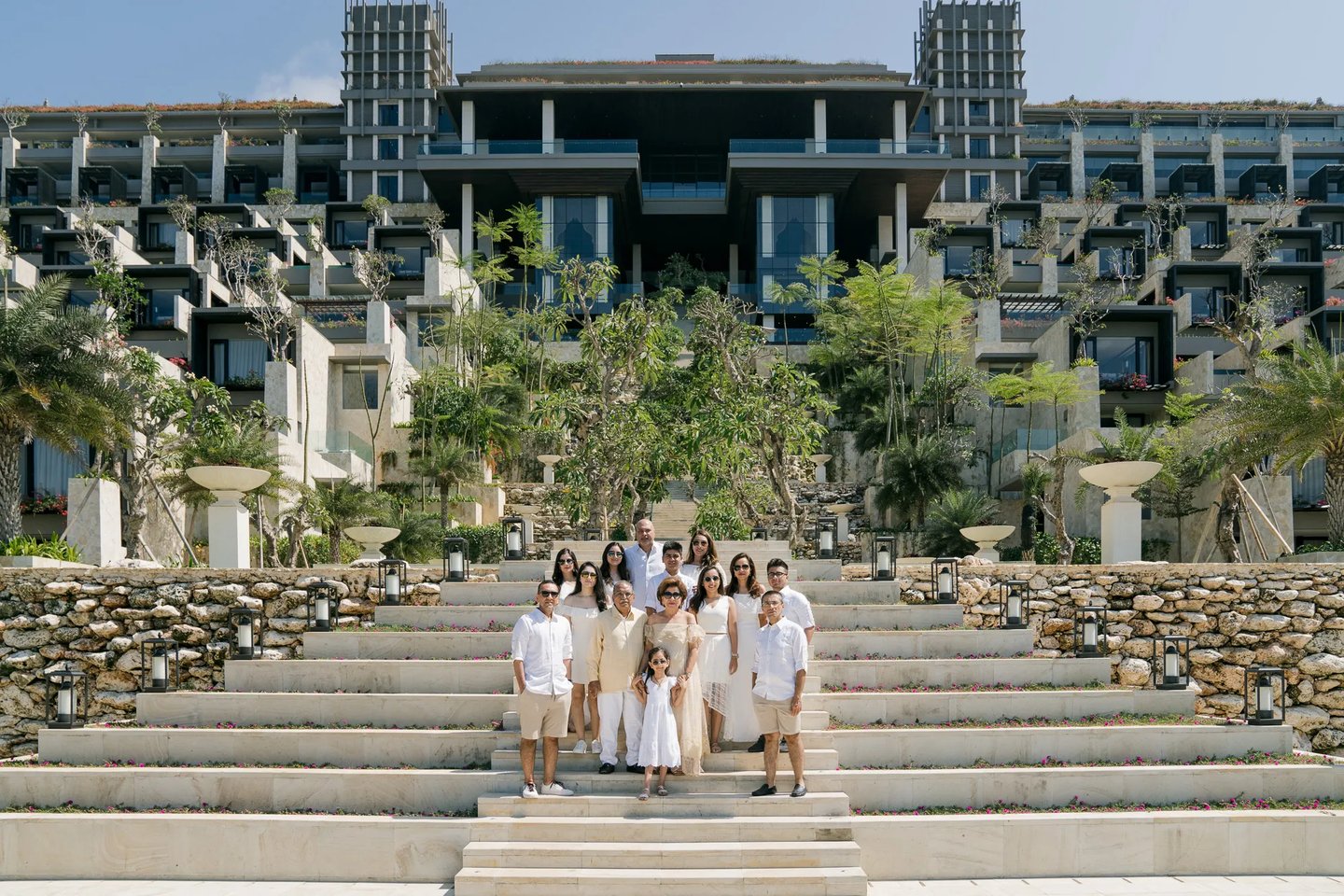 Multi-generation family portrait on the iconic Grand Staircase at The Apurva Kempinski Bali in Nusa Dua