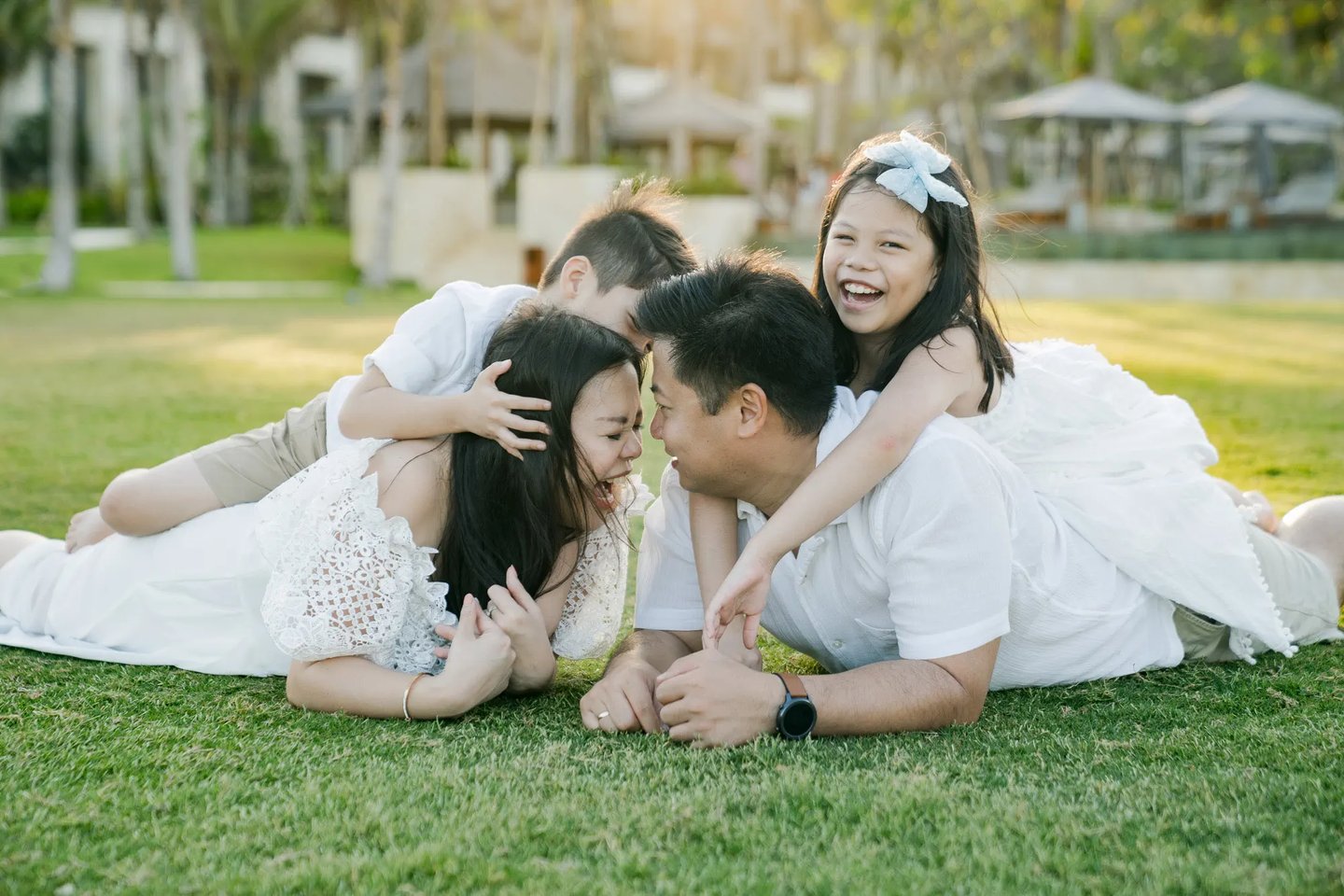 Natural family lifestyle photography on the Ocean Lawn at The Apurva Kempinski Bali