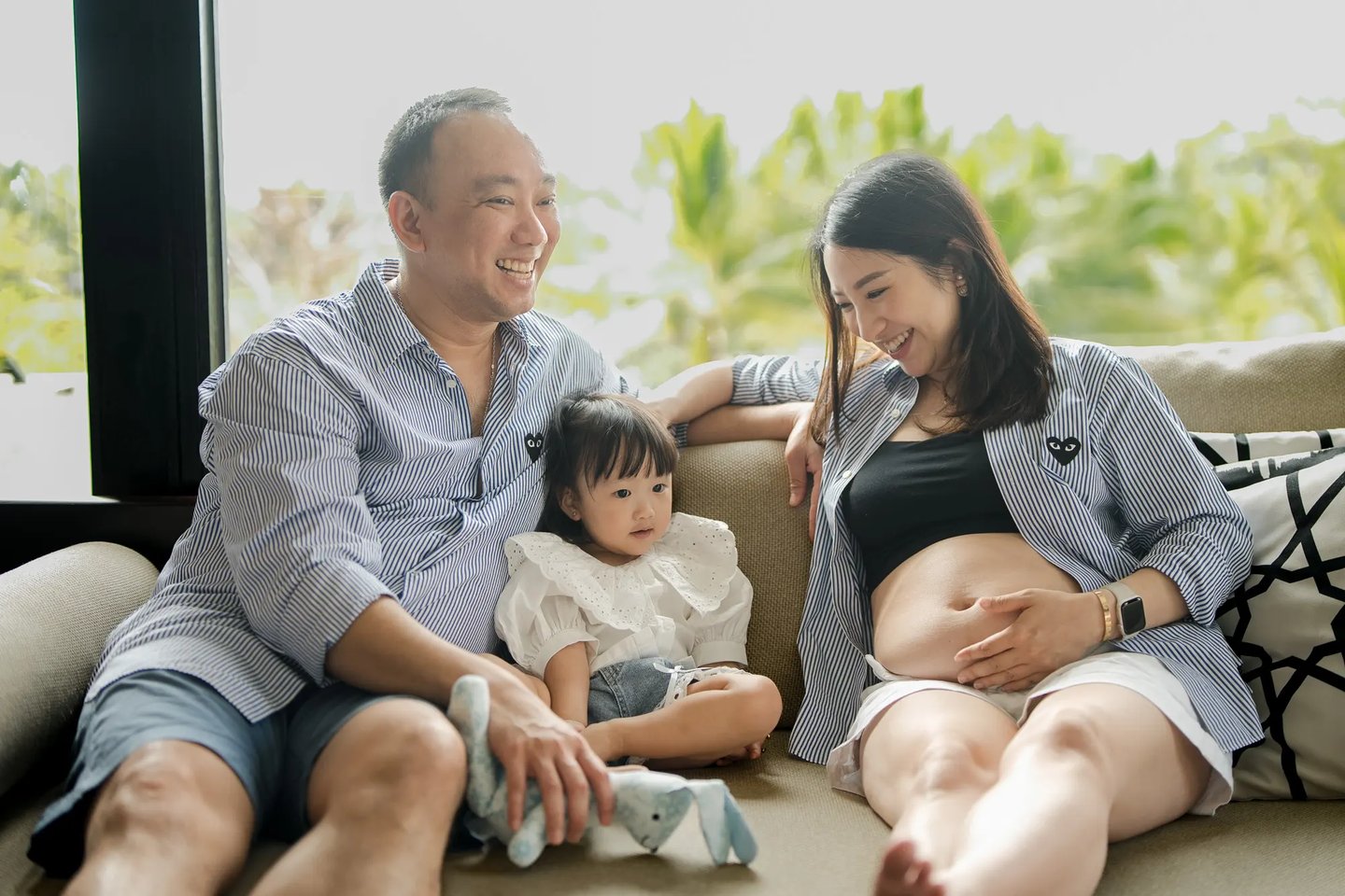 Family maternity photography session inside a luxury suite at The Apurva Kempinski Bali