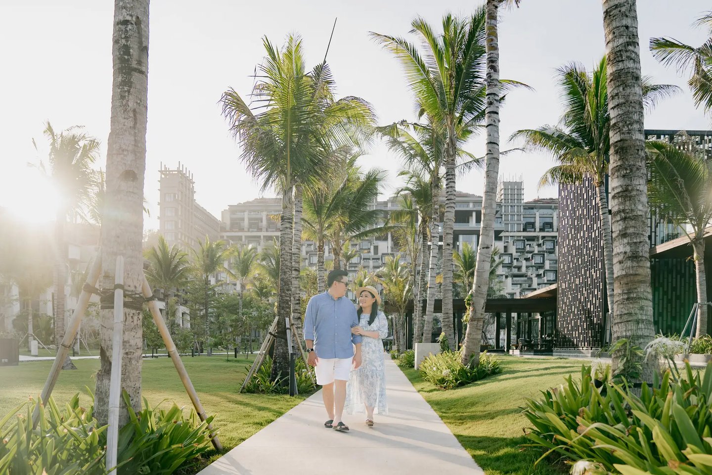 Couple photography session surrounded by tropical gardens at The Apurva Kempinski Bali in Nusa Dua