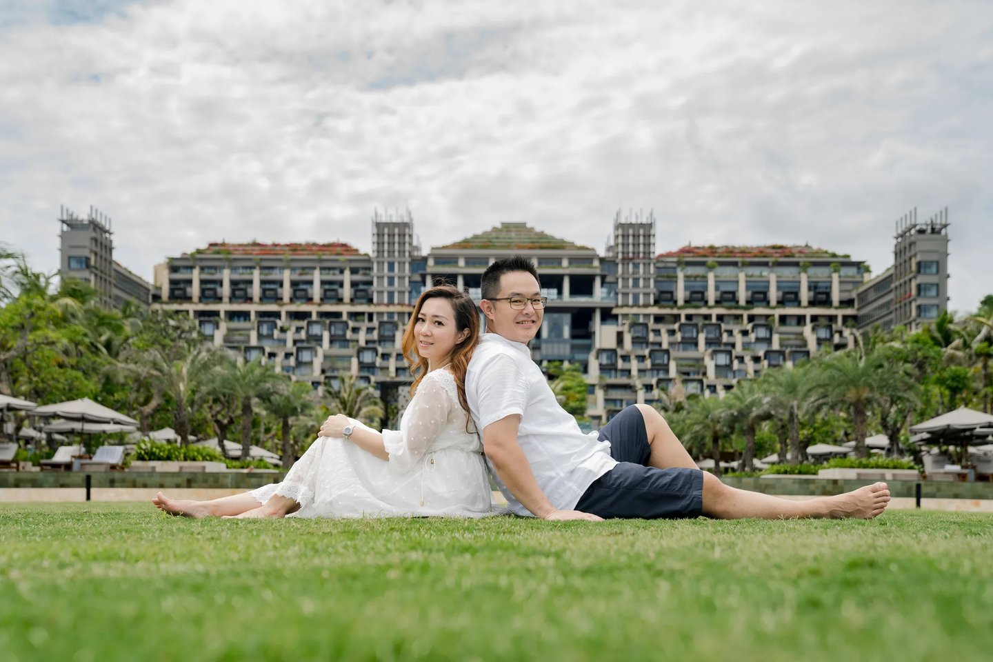Couple portrait on the Ocean Lawn with The Apurva Kempinski Bali as the backdrop