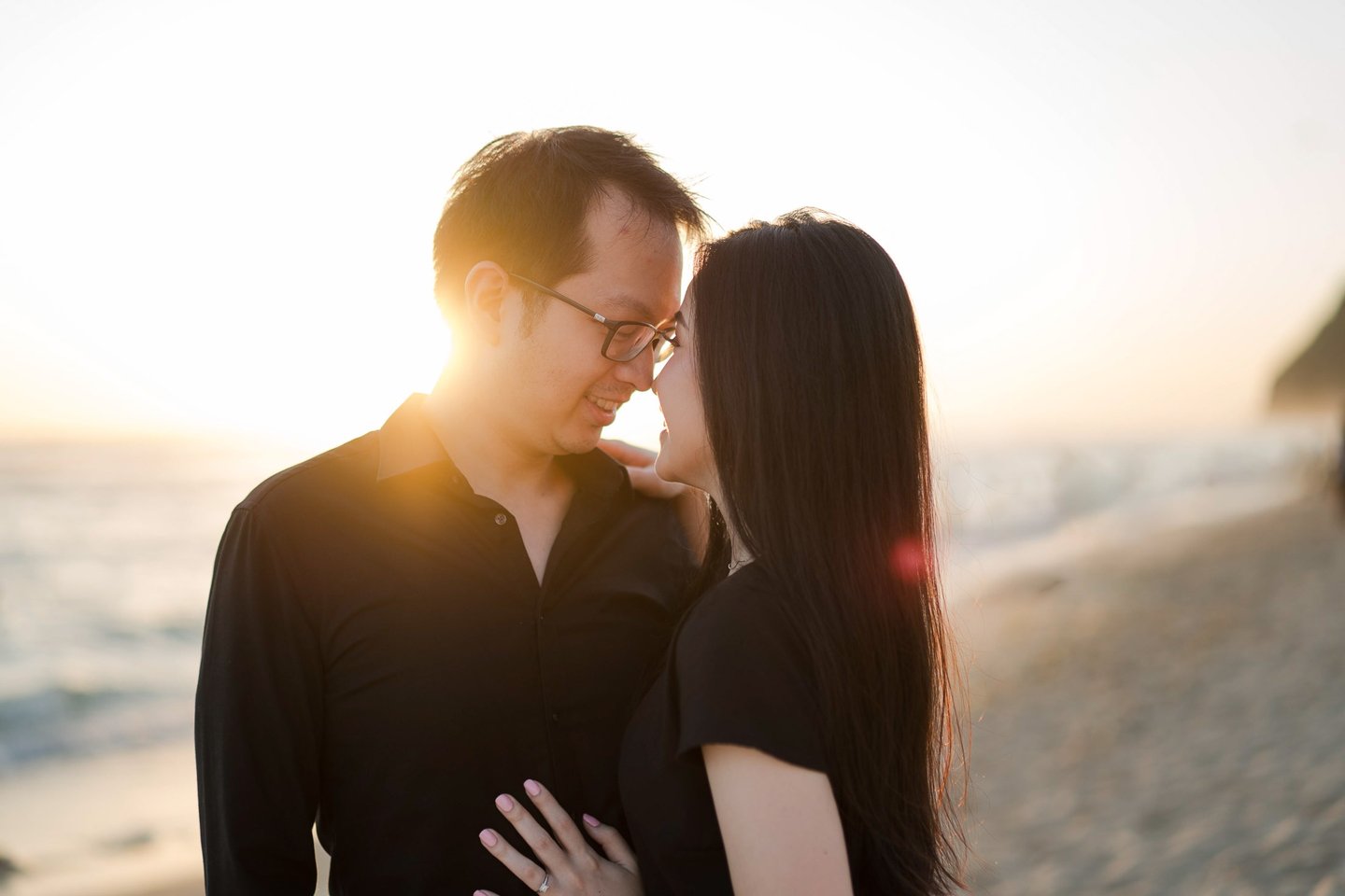 Intimate prewedding couple during golden sunset at Melasti Beach Bali