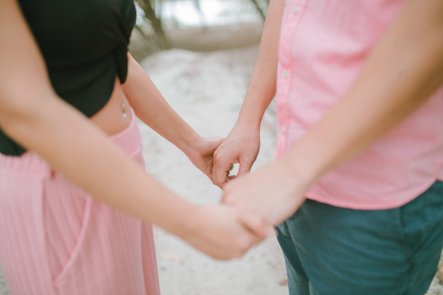 Close up of couple holding hands during an intimate session in Serangan Benoa Bali.