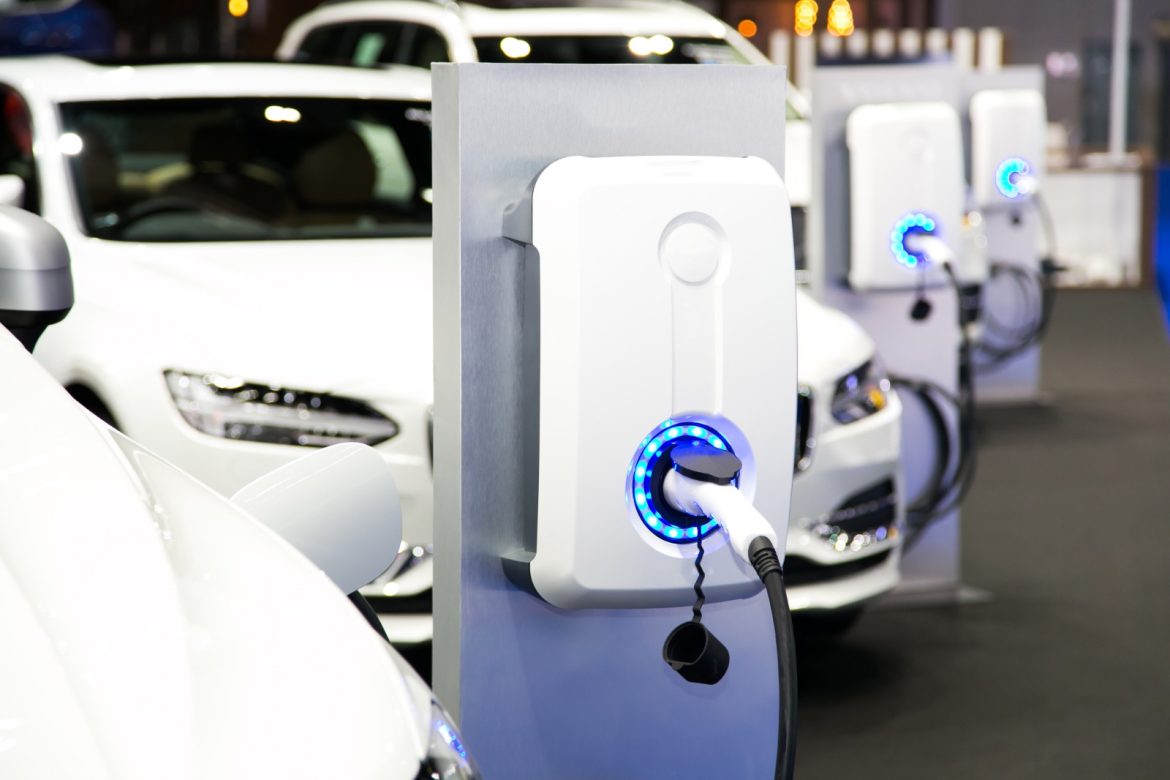 a row of electric cars parked in a row