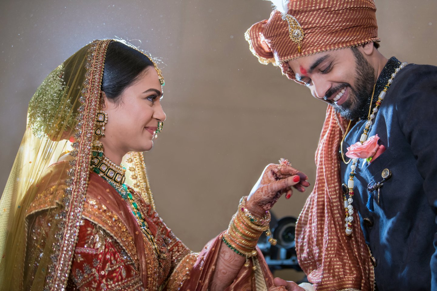 Bride and groom holding hands.