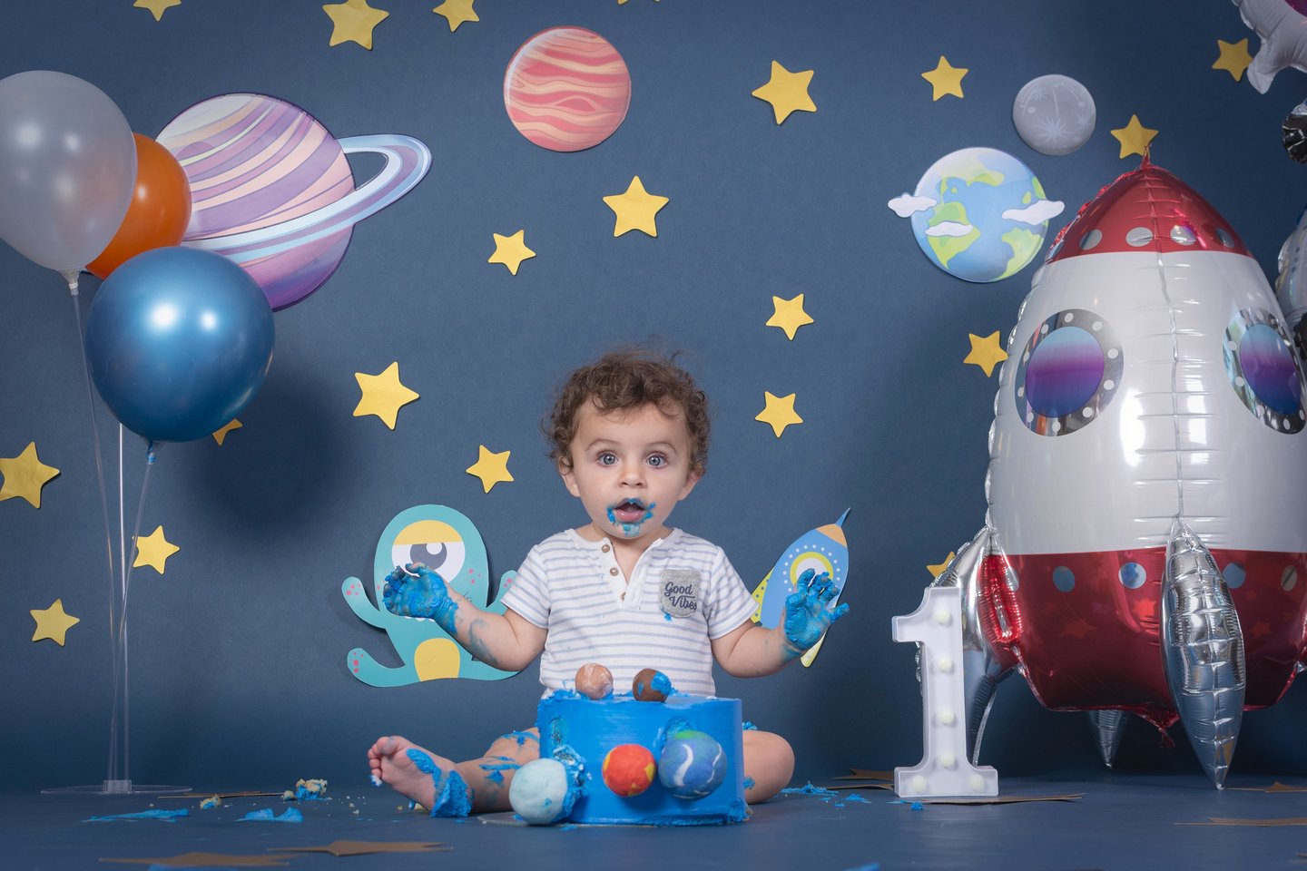 a baby boy in a space themed photo shoot