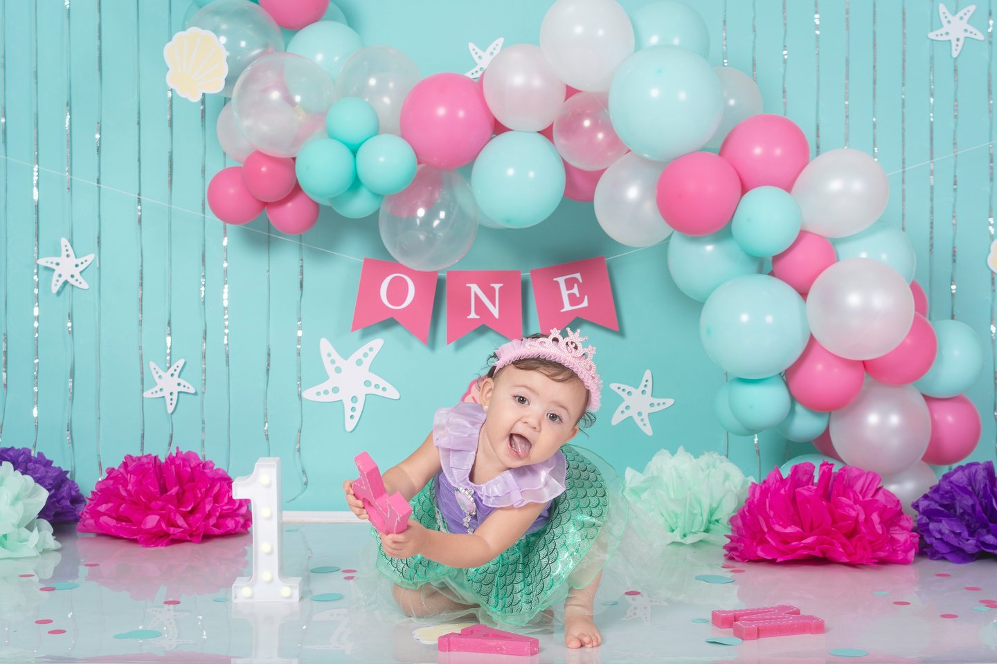 a baby boy in a space themed photo shoot