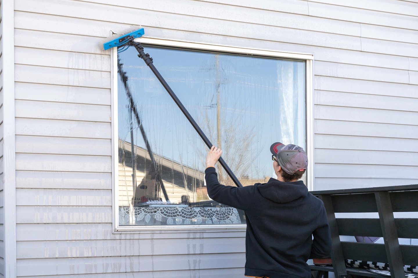 Person washing a window