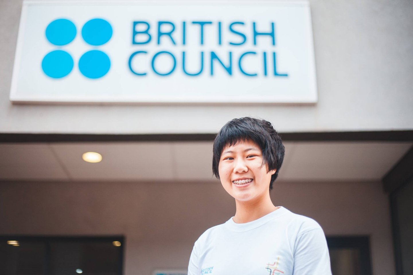 a woman in a white shirt and a blue shirt