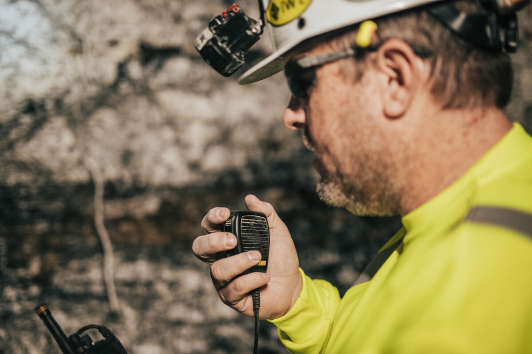 Rescue personnel using their microphone/speaker connected to their PoC device