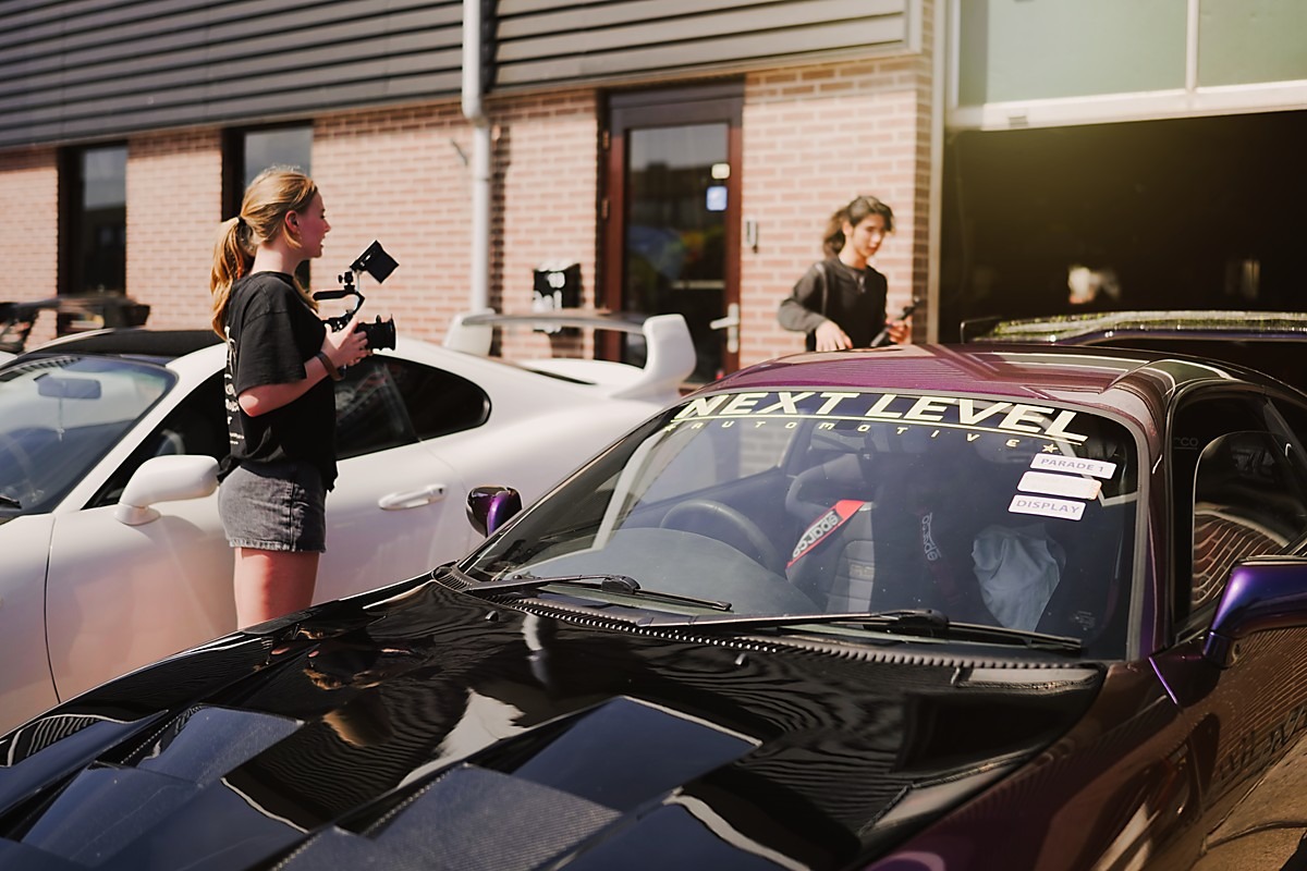 Teenage filmmakers discussing their next shot.