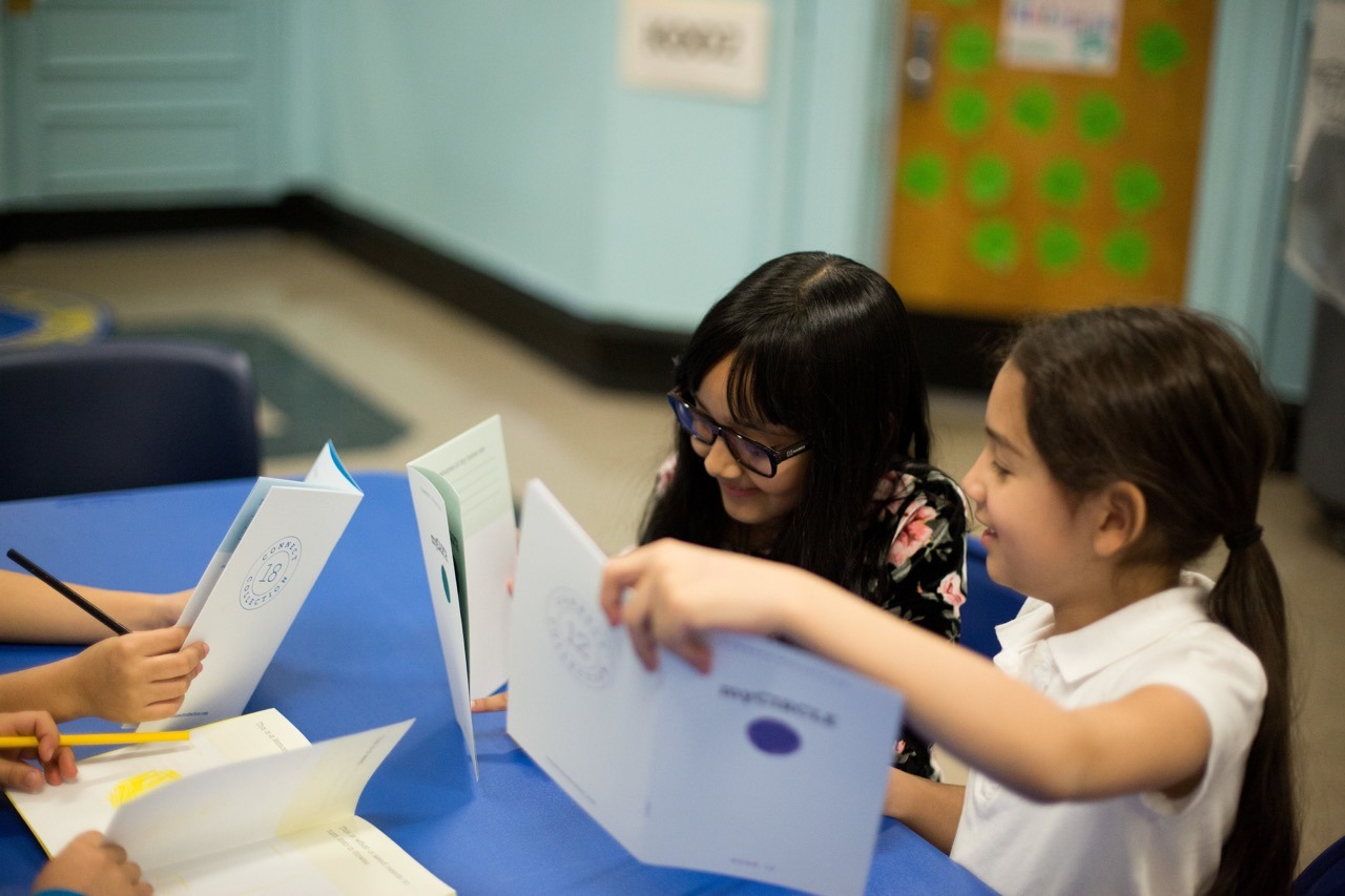 Students enjoy sharing their workbooks with each other.
