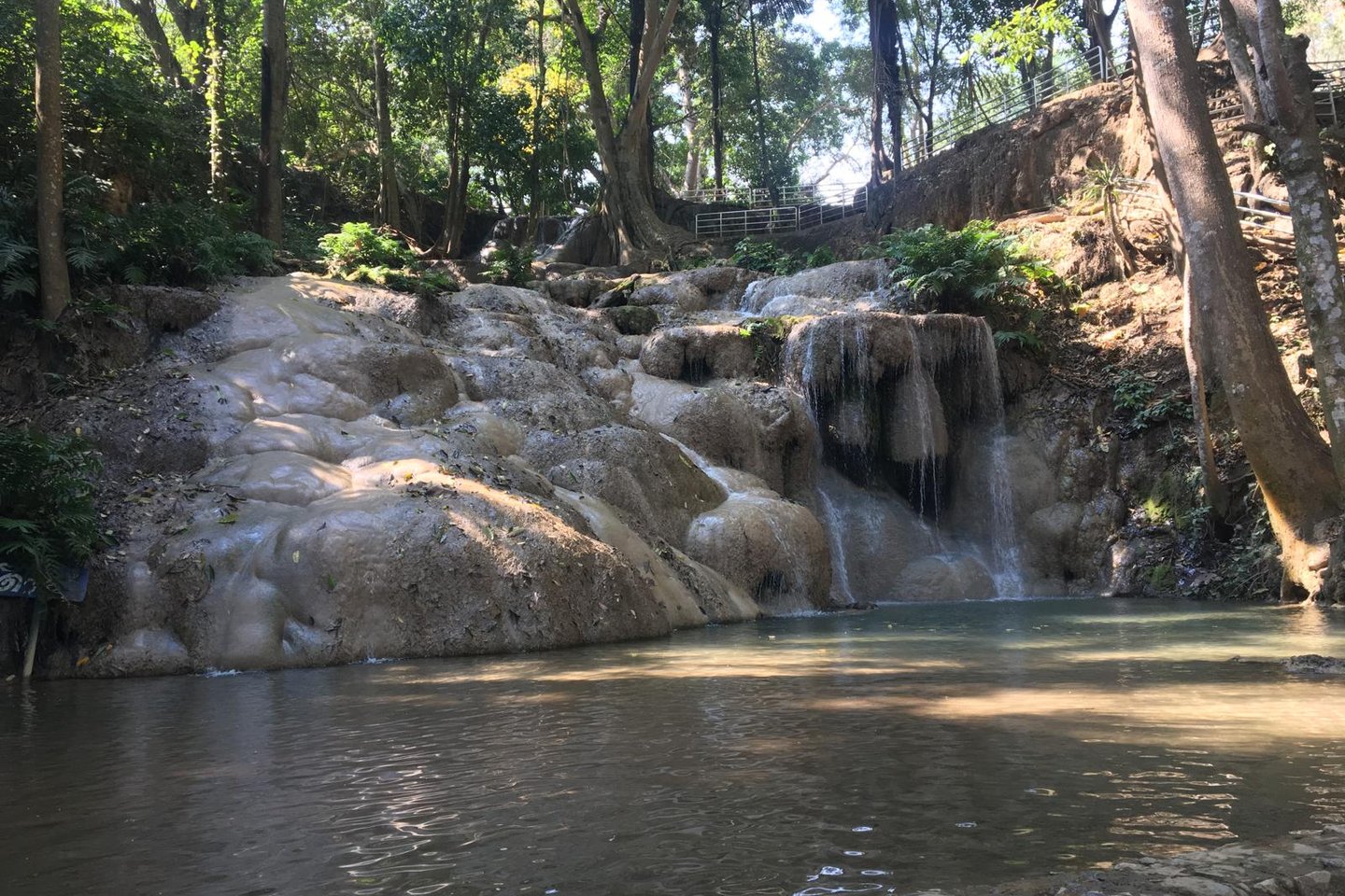 Small forest waterfall in Loei flowing in early season light