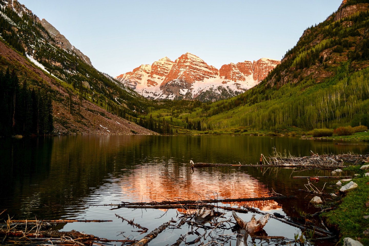 Majestic Maroon Bells in alpen glow of a summer sunrise