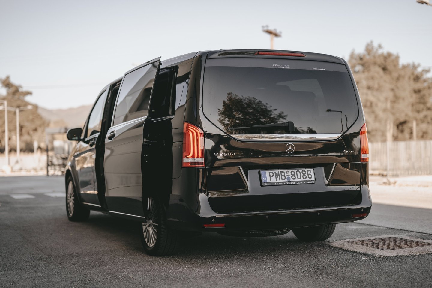 ide view of black Mercedes V-Class with open door for easy passenger boarding