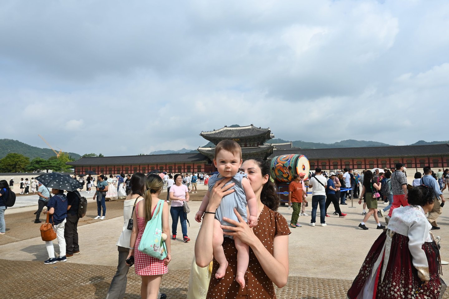 a woman holding a baby
