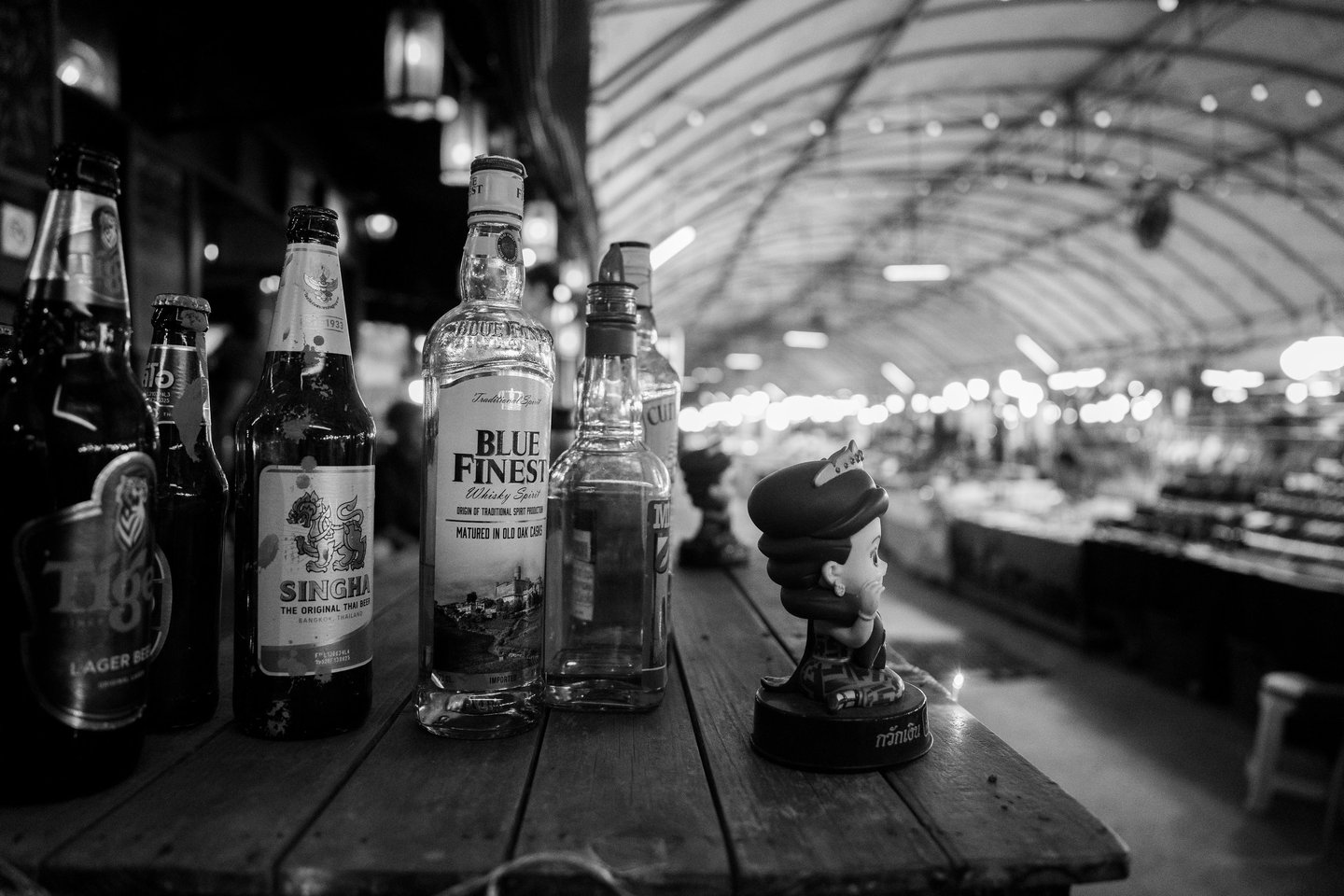 A bar with beers and bottles of alcoholic drinks in the Night Bazaar area of Chiang Mai in Thailand
