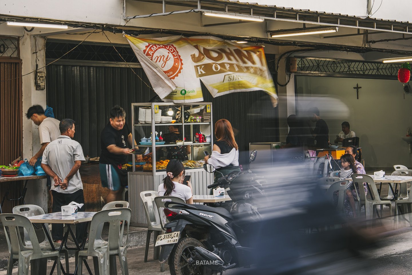 outdoor area and motorcycle crossing at Johny Kopitiam Batam