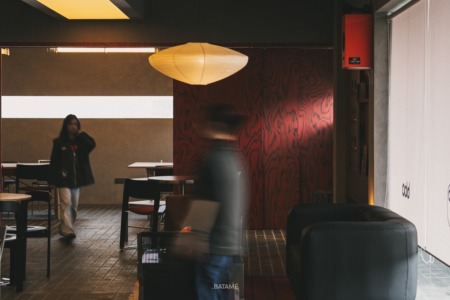 aesthetic Mid-Japandi interior with people passing at odd Batam