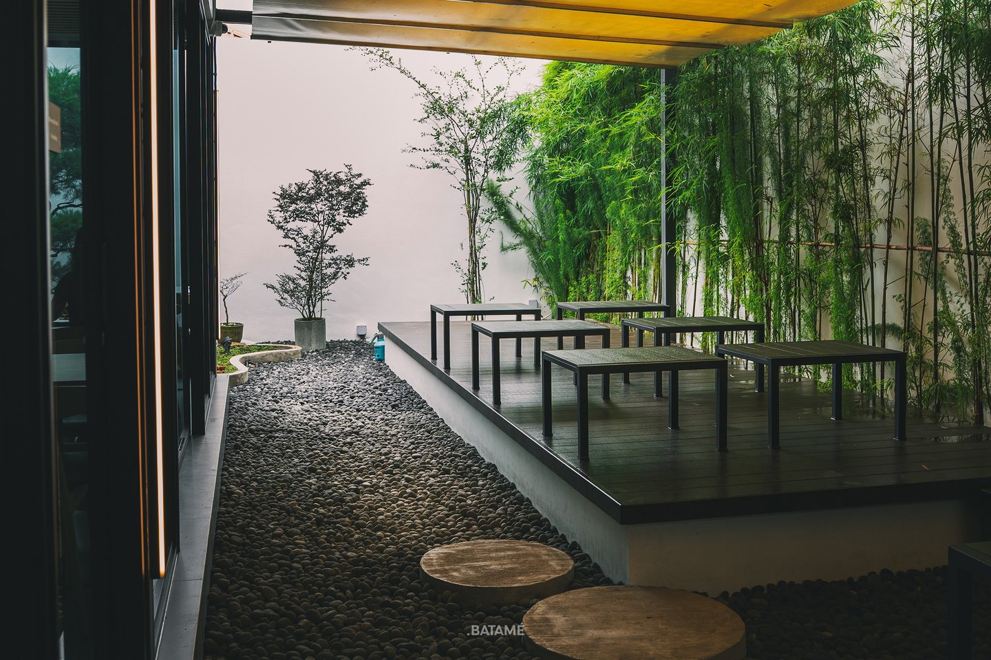 Greeneries and outdoor seating at Towzen Batam