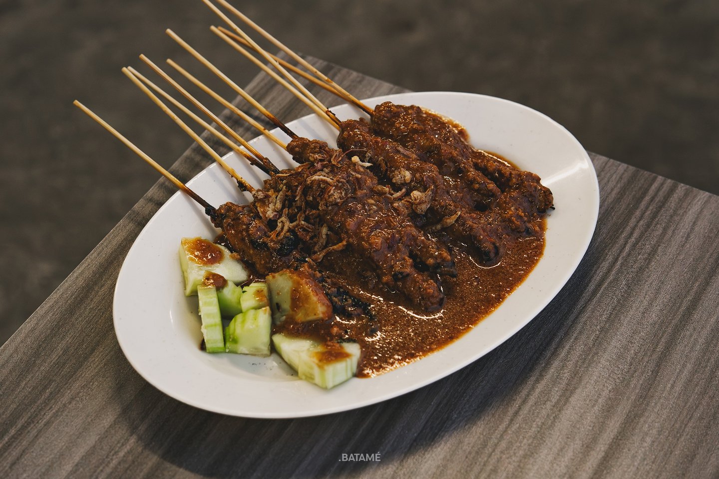 a plate of chicken satay at Johny Kopitiam Batam