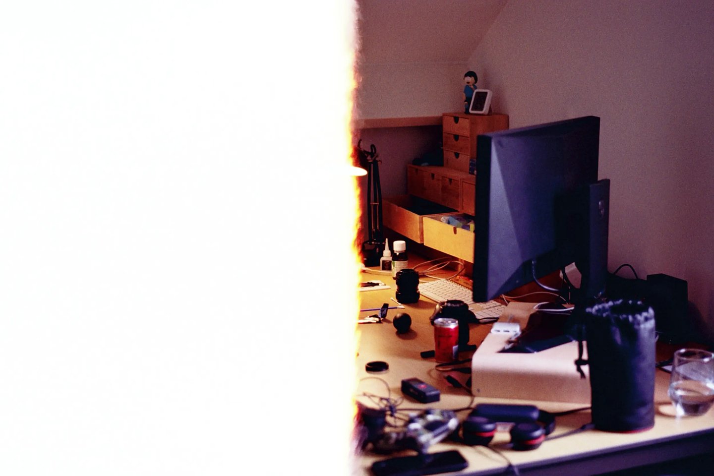 Bogdan Dobrin workspace desk with 35mm film burn. Unedited SOOC photography process.