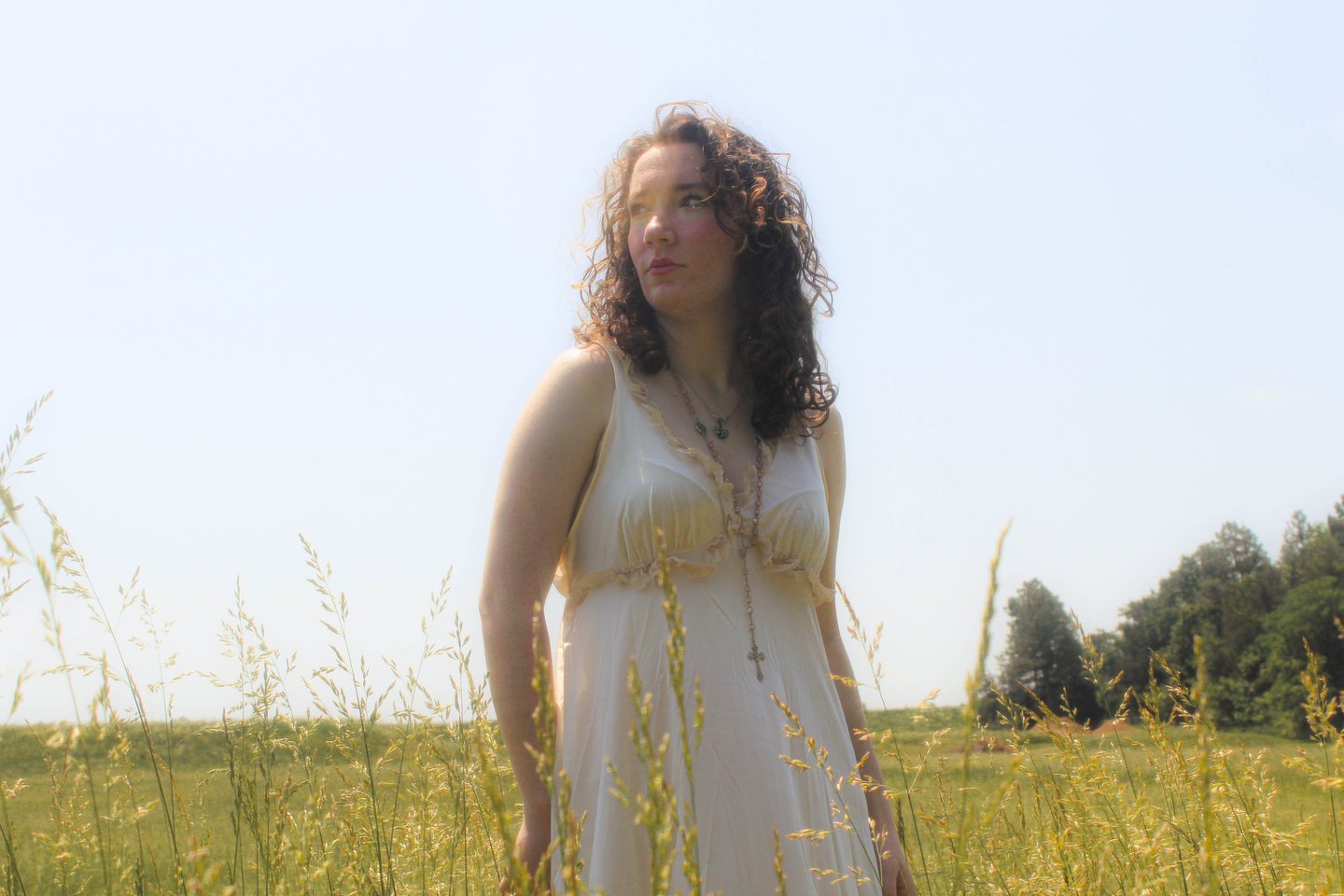 Ethereal high school senior portrait at golden hour at crockett park, virginia