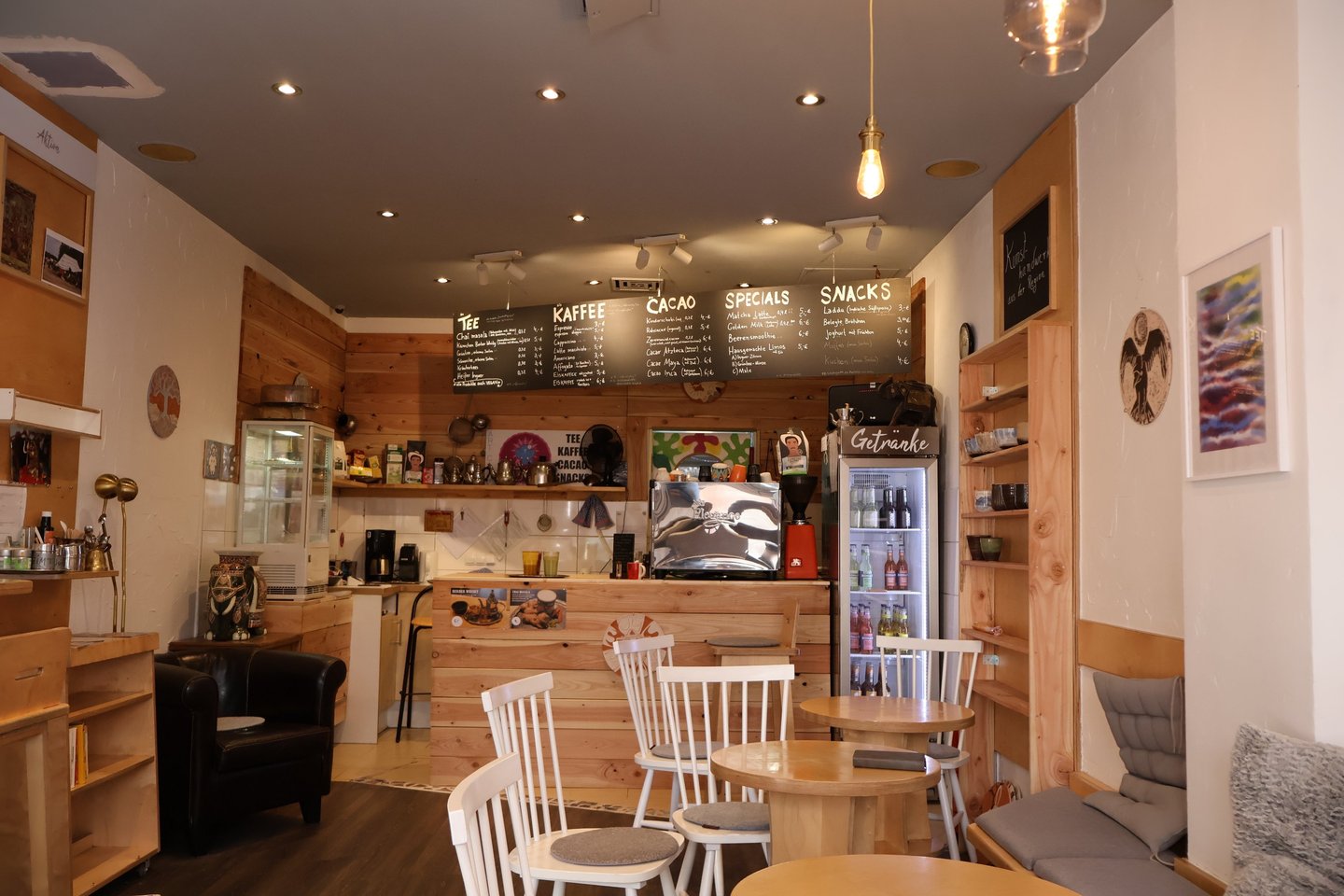 a cafe with a small table and chairs