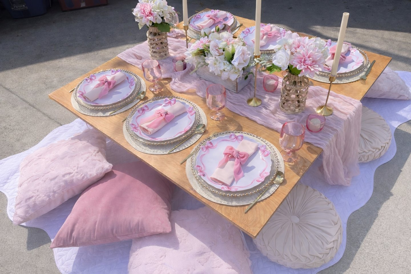 Gathered Grace Picnic Co pink coquette bow styled luxury picnic table with elegant soft pink decor
