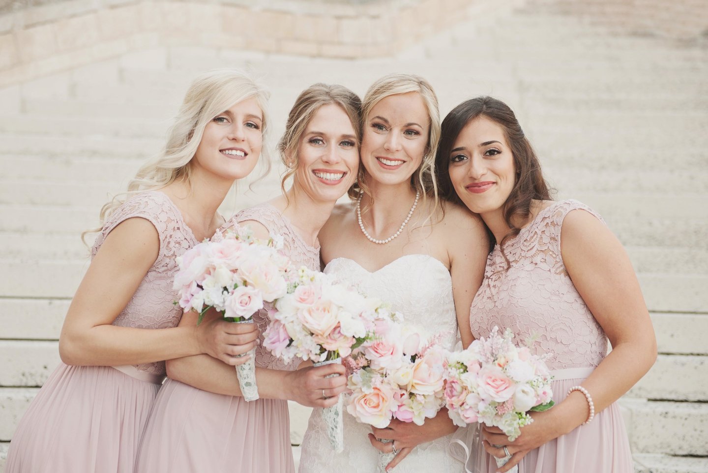 a bride and bridesmaids in a wedding 