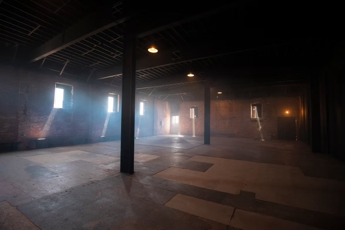 Warehouse loft rental Los Angeles — Grayfox Studios industrial space with exposed brick, steel beams, and natural light