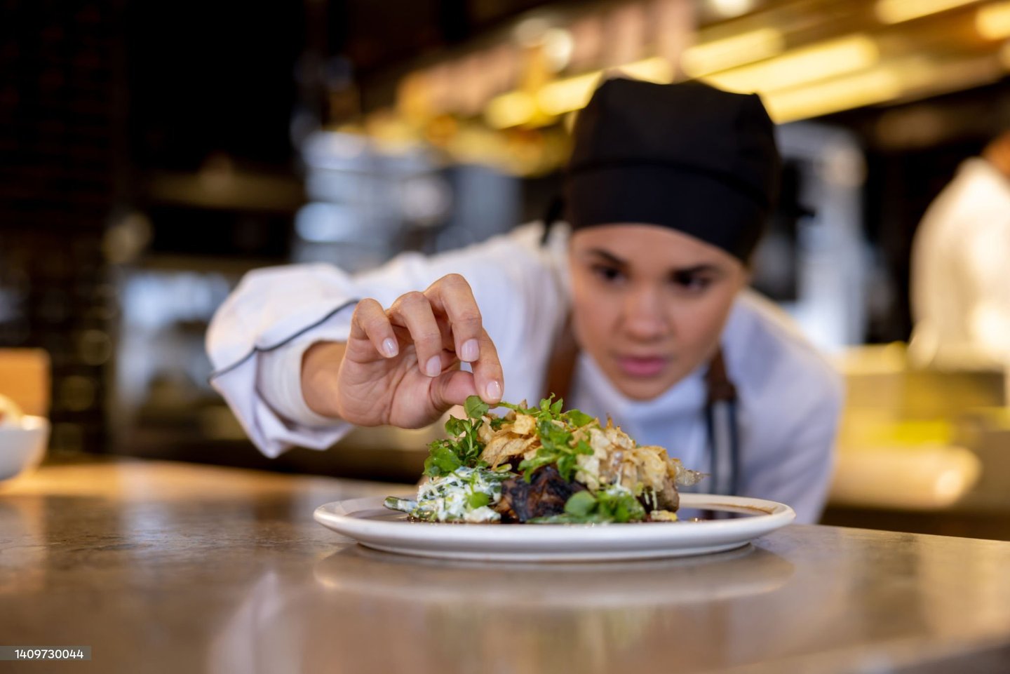 a chef is preparing to serve a meal