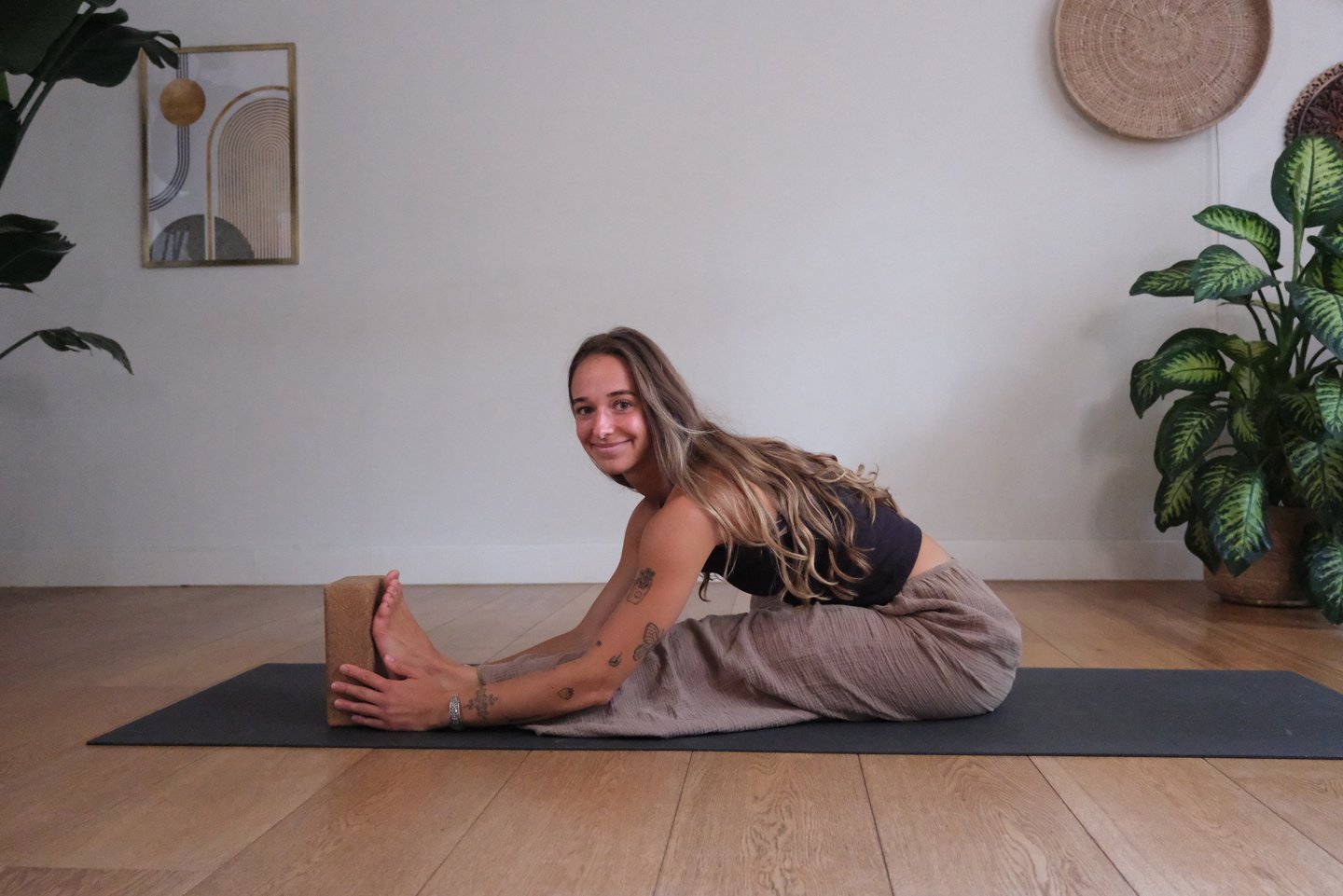 Yoga teacher Jean demonstrating a seating stretch